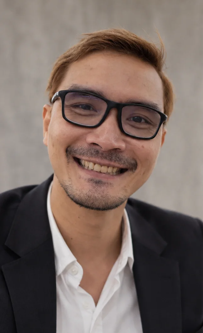 AI-styled business portrait of Prapak Panyachaypond in a dark blazer and white shirt
